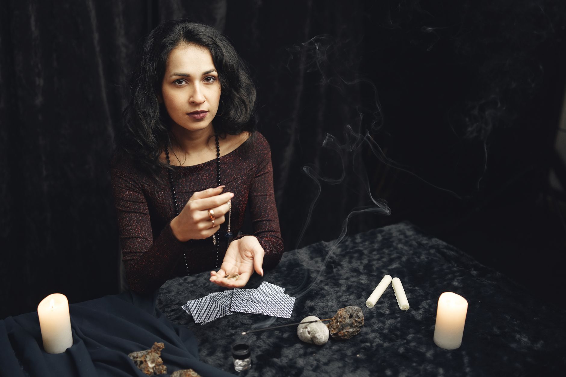A calm, atmospheric scene evoking scrying tarot under full moon comparative divination methods.